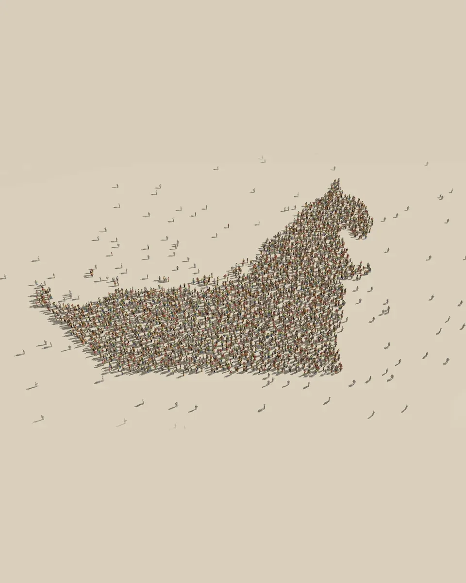 Thousands of small figures standing together in the shape of the United Arab Emirates