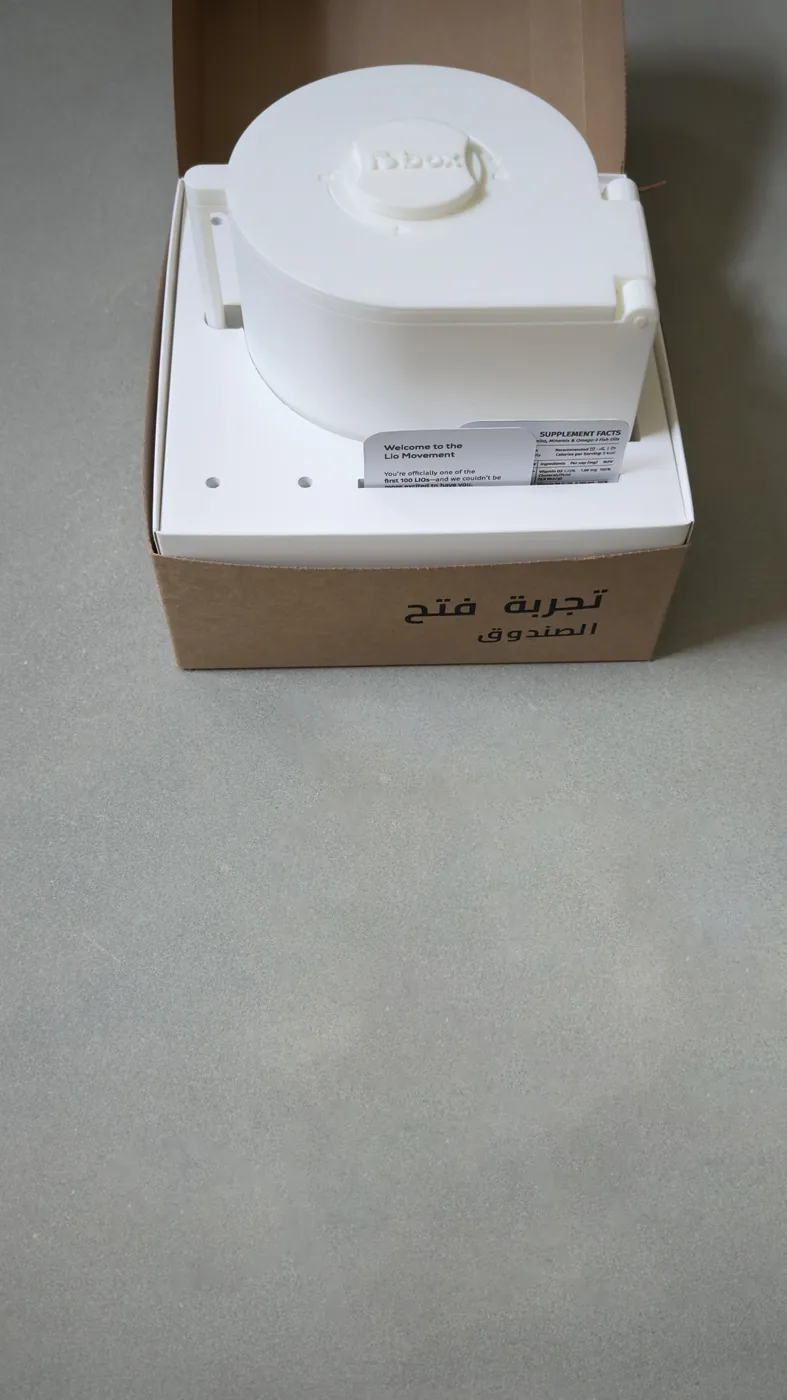 An opened LioBox box with the white LioBox inside